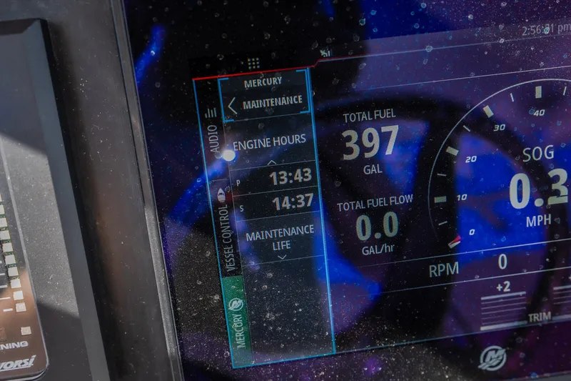 Slide: The Image of Dashboard display of 2023 Fountain 34 Tournament Edition showing engine hours and fuel data. - 87