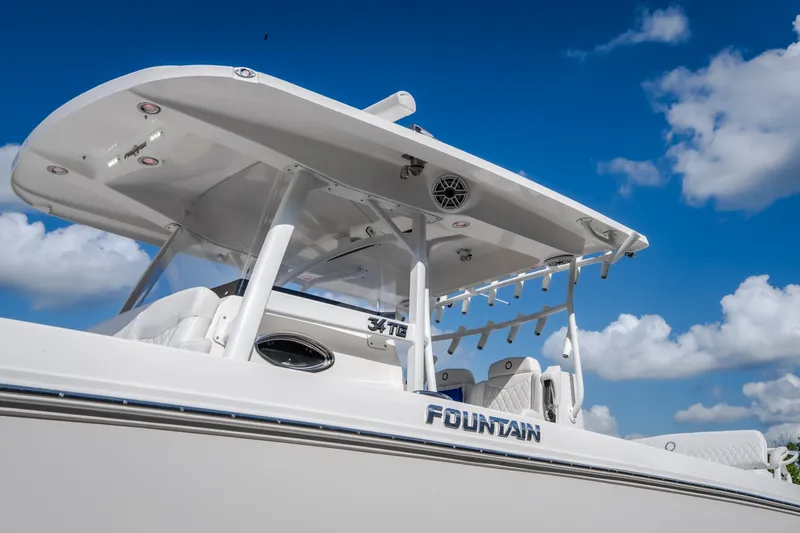 Slide: The Image of 2023 Fountain 34 Tournament Edition boat against a blue sky with clouds. - 47