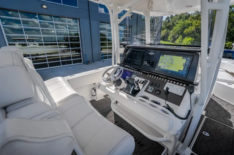 Slide: The Image of 2023 Fountain 34 Tournament Edition boat cockpit with advanced navigation system and luxurious seating. - 52