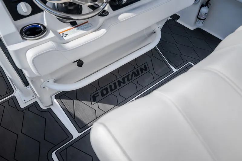 Slide: The Image of 2023 Fountain 34 Tournament Edition boat interior with branded flooring and seating. - 91