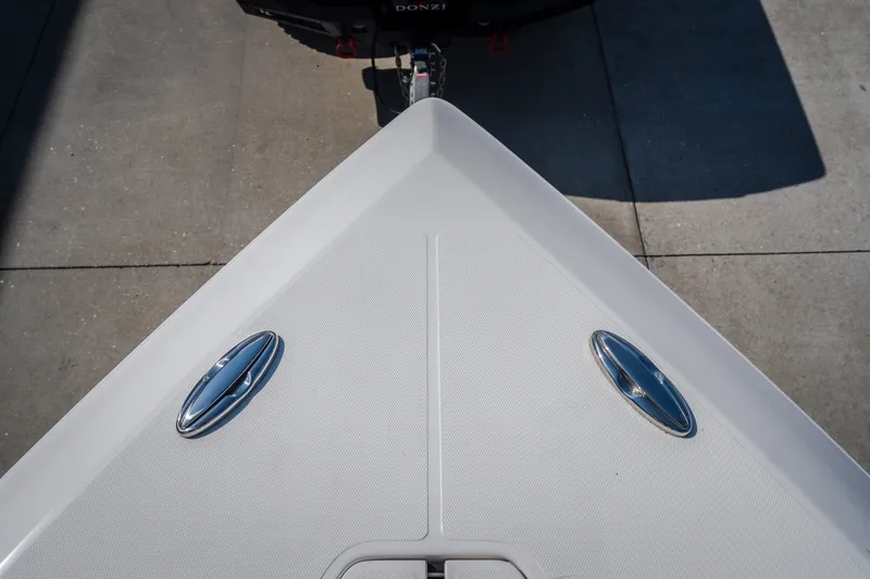 Slide: The Image of Bow of 2023 Fountain 34 Tournament Edition boat with sleek design and cleats. - 89