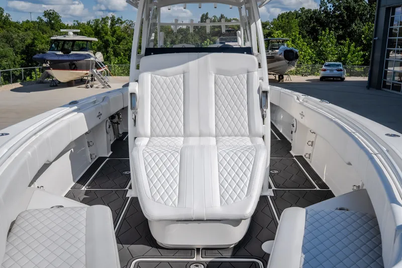 Slide: The Image of 2023 Fountain 34 Tournament Edition boat with luxurious white seating and sleek design. - 70