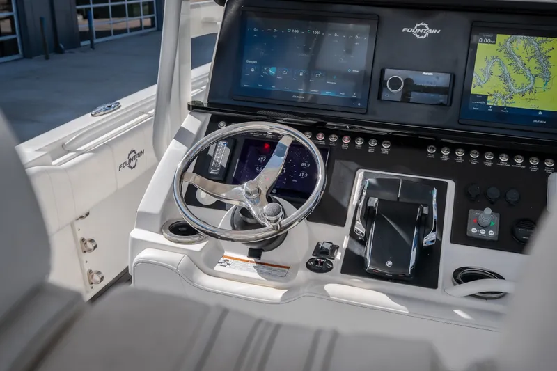 Slide: The Image of 2023 Fountain 34 Tournament Edition boat dashboard with advanced navigation and control systems. - 50