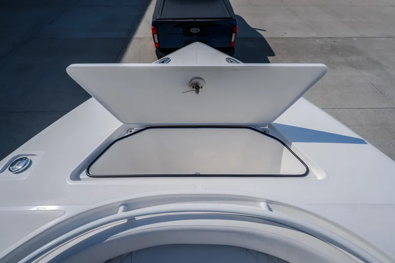 Slide: The Image of Open storage compartment on 2023 Fountain 34 Tournament Edition boat deck. - 67