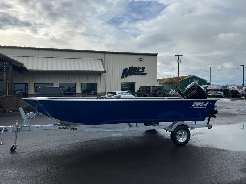 Slide: The Image of 2024 RH Boats Pro V 18 on Karavan trailer outside Mel's building. - 14