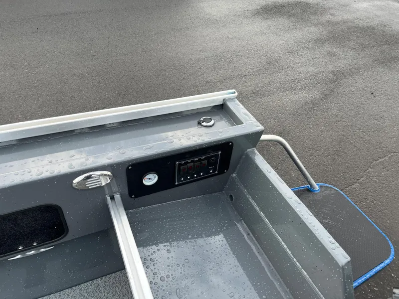 Slide: The Image of 2024 RH Boats Pro V 18 interior dashboard and controls. - 3