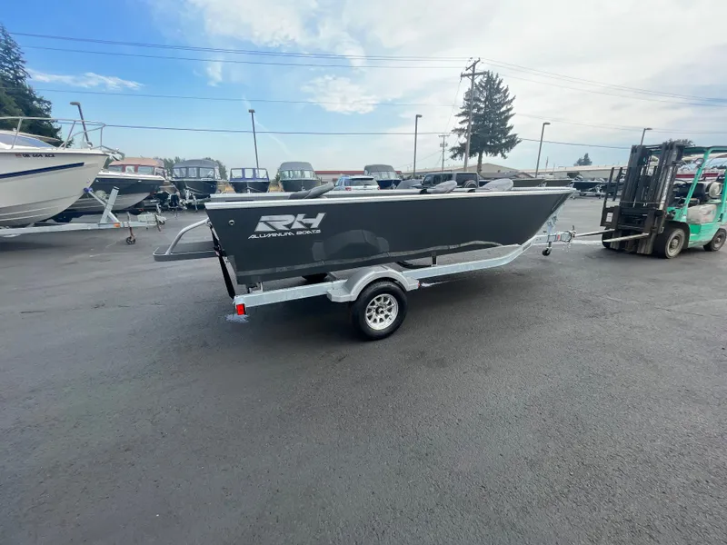 Slide: The Image of 2024 RH Boats Pro V 18 on trailer in boat dealership lot. - 6