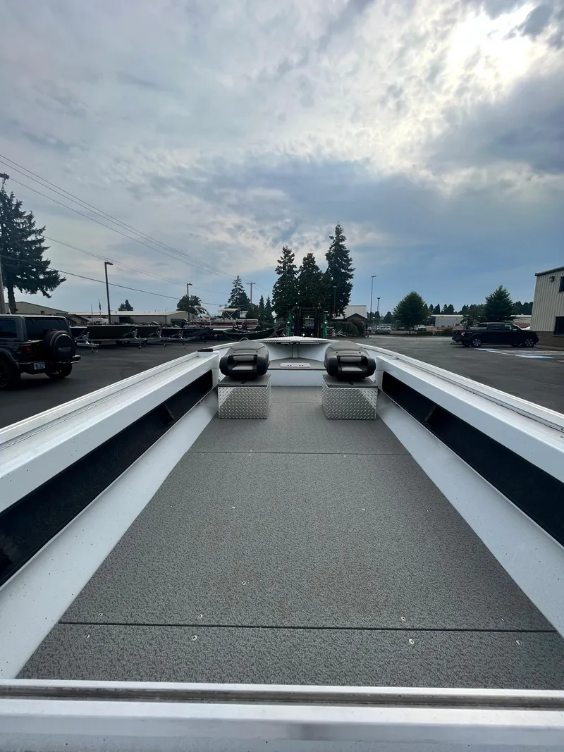 Slide: The Image of 2024 RH Boats Pro V 18, spacious deck, parked outdoors. - 8