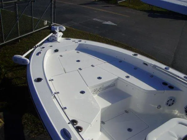 Slide: The Image of 2023 Crevalle 26HCO boat deck with storage compartments and fishing equipment. - 5