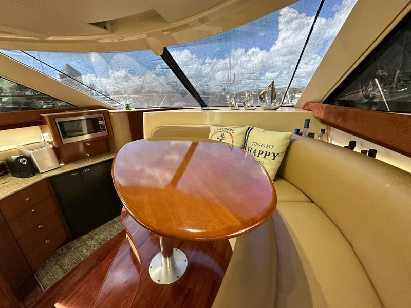Slide: The Image of Interior of 2007 Meridian 391 Sedan yacht with dining area and kitchenette. - 12