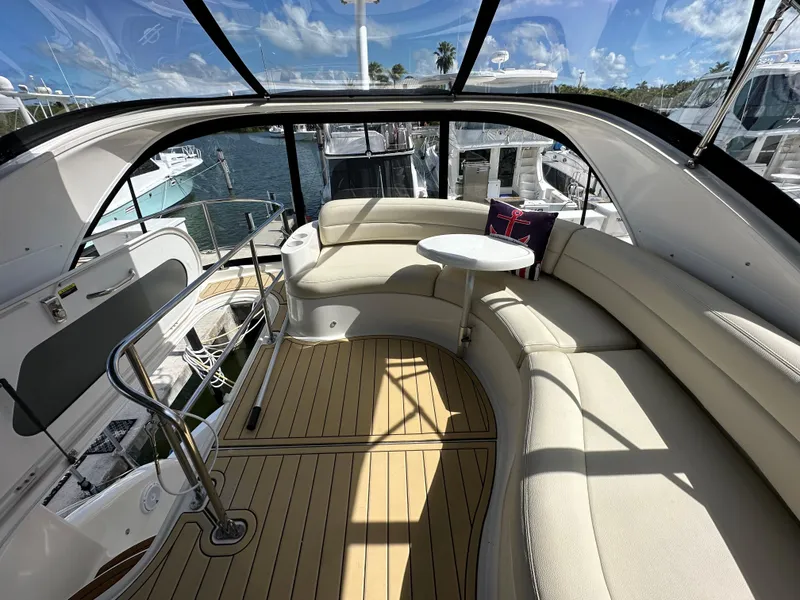 Slide: The Image of Luxurious 2007 Meridian 391 Sedan yacht interior with curved seating and table. - 16