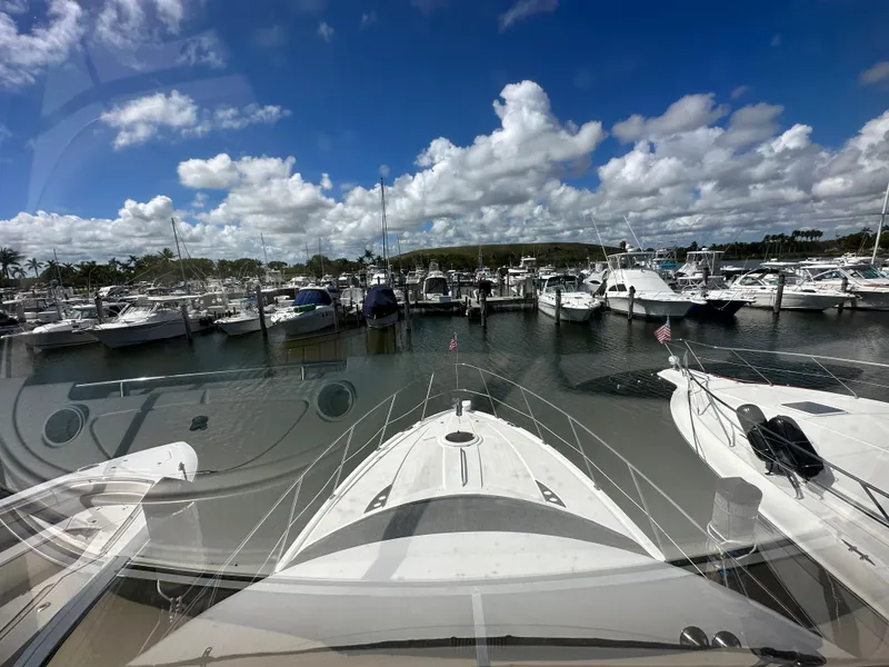 Slide: The Image of View from a 2007 Meridian 391 Sedan yacht docked at a marina under a blue sky. - 20
