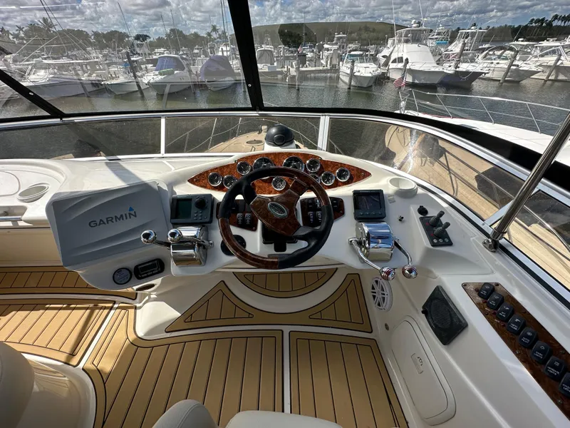Slide: The Image of 2007 Meridian 391 Sedan helm with Garmin navigation, docked at marina. - 21