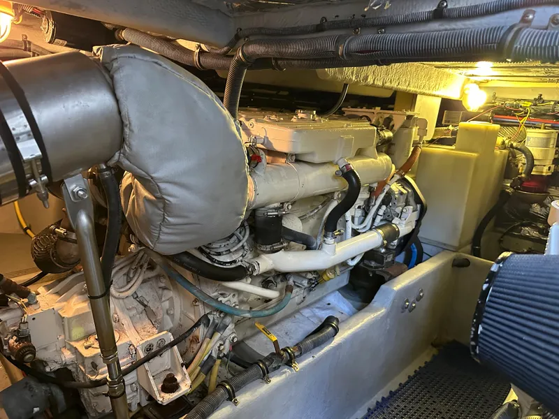 Slide: The Image of Engine room of a 2007 Meridian 391 Sedan yacht, showcasing the engine and mechanical components. - 24
