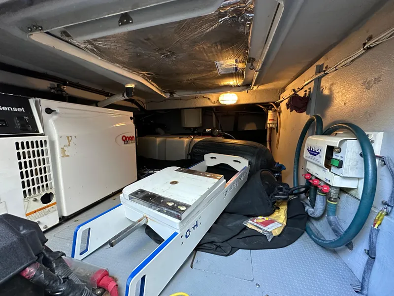 Slide: The Image of Engine room of a 2007 Meridian 391 Sedan yacht with generator and equipment. - 27