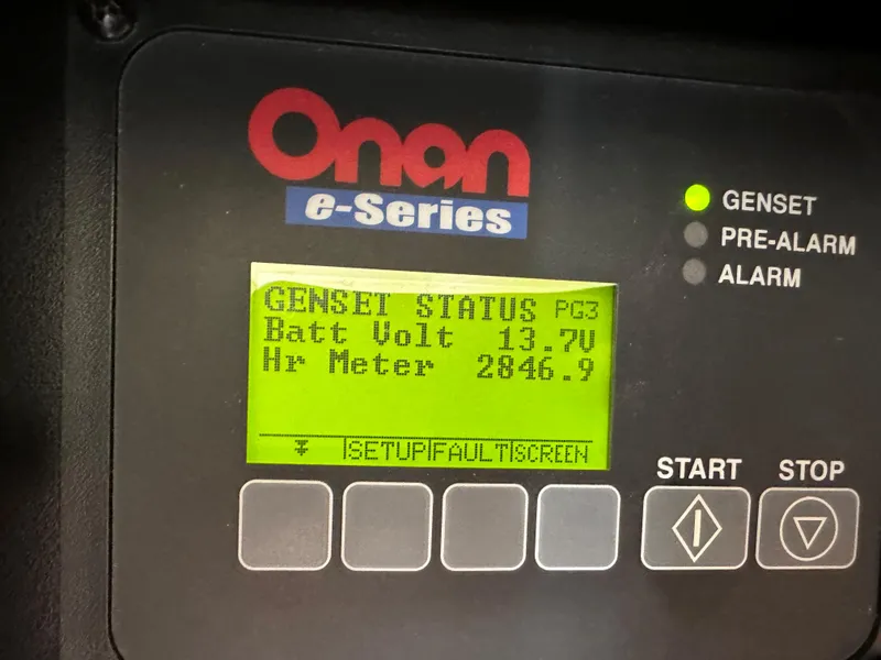 Slide: The Image of Onan e-Series generator display showing battery voltage and hour meter. - 29