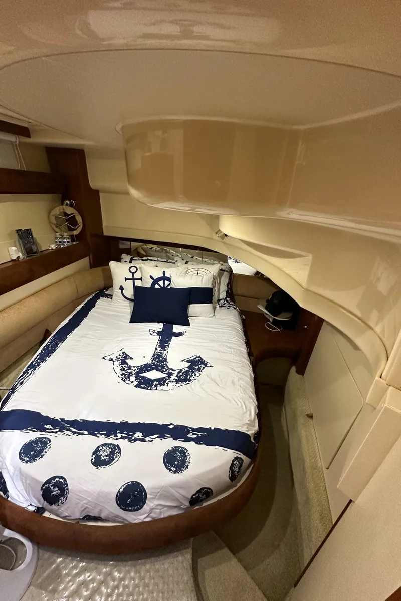 Slide: The Image of 2007 Meridian 391 Sedan bedroom with nautical-themed bedding. - 33