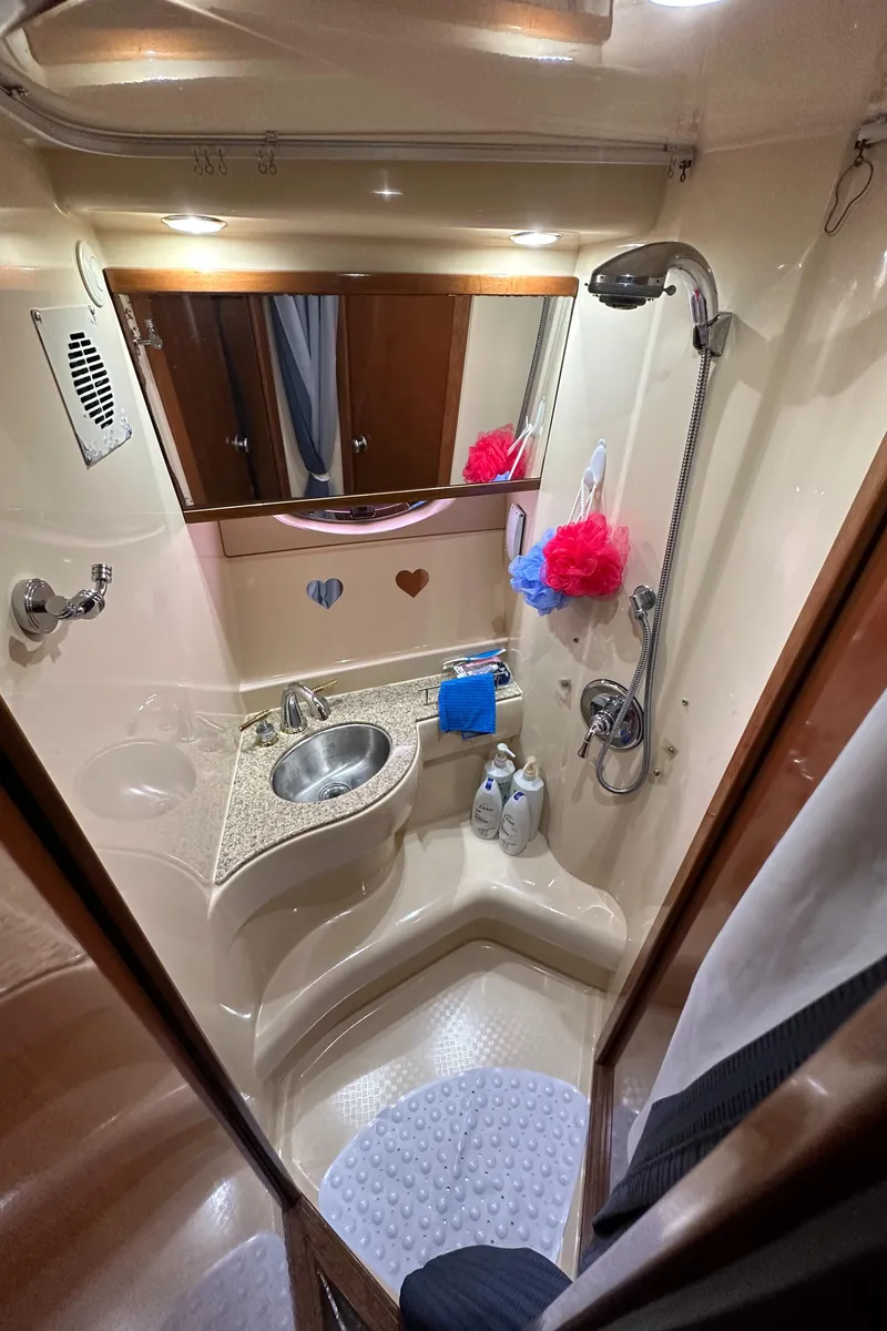 Slide: The Image of 2007 Meridian 391 Sedan bathroom with shower, sink, and mirror. - 34