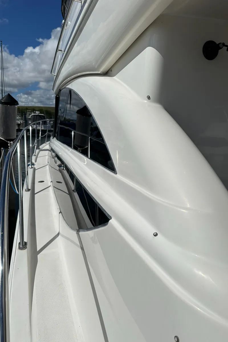 Slide: The Image of 2007 Meridian 391 Sedan yacht side view with sleek white exterior. - 37