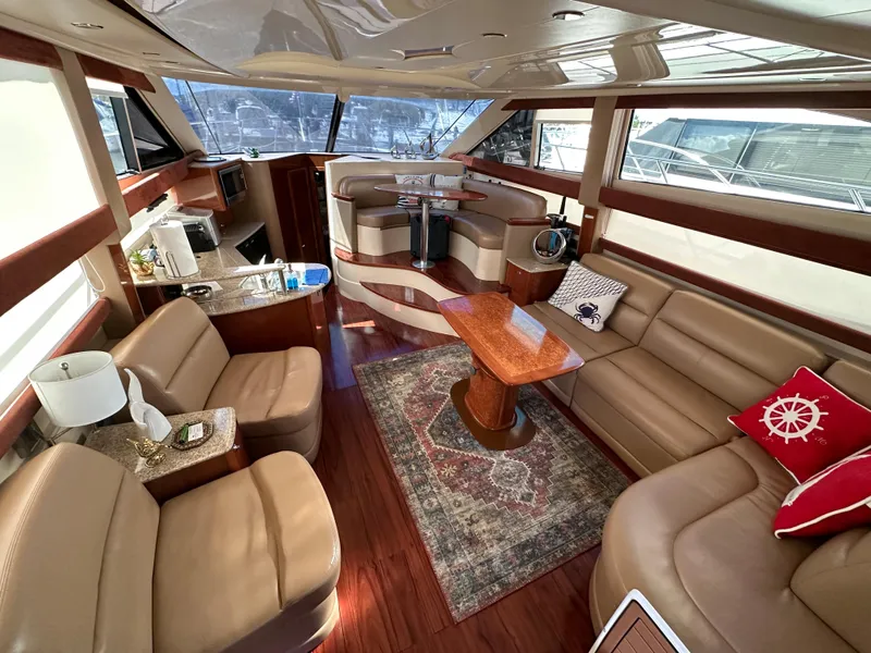 Slide: The Image of Luxurious interior of a 2007 Meridian 391 Sedan yacht with leather seating and wooden accents. - 6