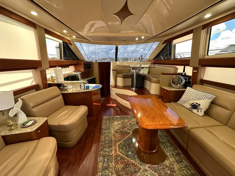 Slide: The Image of Luxurious interior of a 2007 Meridian 391 Sedan yacht with leather seating and wooden accents. - 7