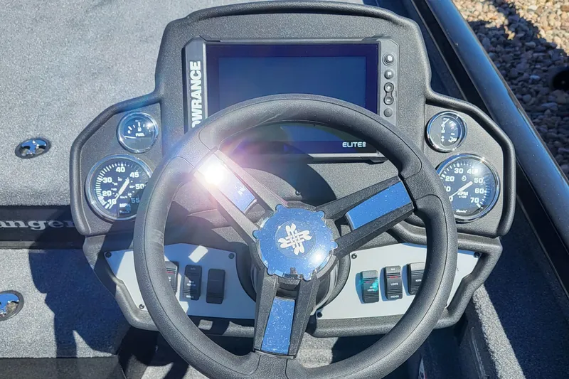 Slide: The Image of 2023 Ranger RT198P boat dashboard with steering wheel and Lowrance Elite fishfinder. - 3
