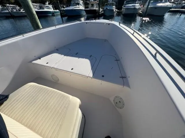 Slide: The Image of 2001 Grady-White Bimini 306 boat interior, docked in marina with other boats. - 15