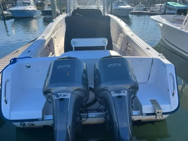 Slide: The Image of 2001 Grady-White Bimini 306 boat with twin 225 horsepower engines docked at marina. - 3