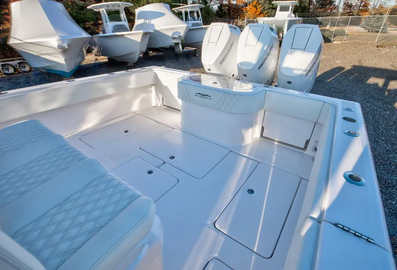 Slide: The Image of 2024 Invincible 39 Open Fisherman boat with spacious deck and quad outboard engines. - 11