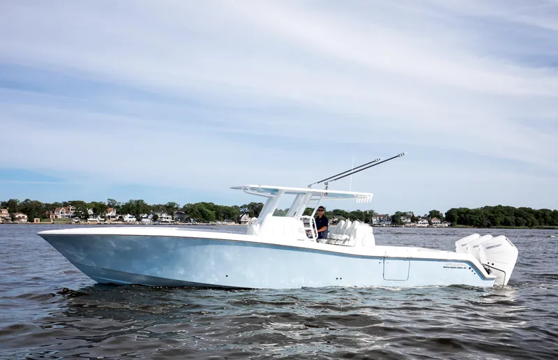 Slide: The Image of 2024 Invincible 39 Open Fisherman boat cruising on calm waters. - 3