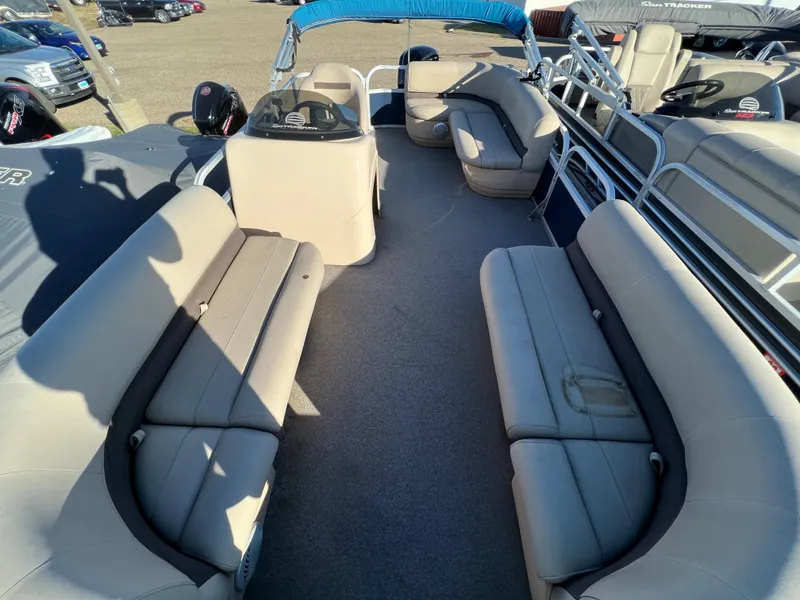 Slide: The Image of 2019 Sun Tracker Party Barge 18 DLX interior with spacious seating and helm station. - 3