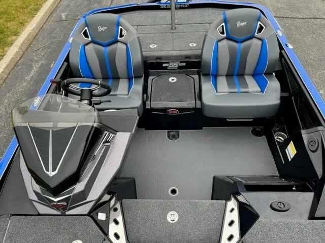 Slide: The Image of 2023 Ranger Z520R boat interior with dual seats and modern dashboard. - 3