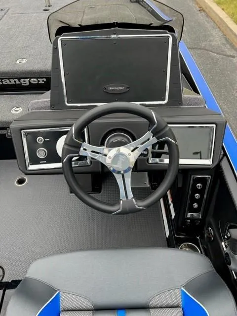 Slide: The Image of 2023 Ranger Z520R boat dashboard with steering wheel and control panel. - 4
