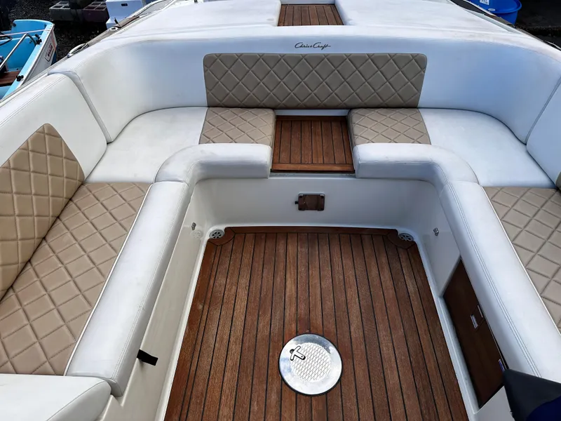 Slide: The Image of 2014 Chris-Craft 28 LAUNCH boat with luxurious seating and teak flooring. - 10