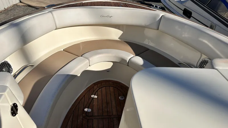 Slide: The Image of 2014 Chris-Craft 28 LAUNCH boat with spacious seating and wooden deck. - 17