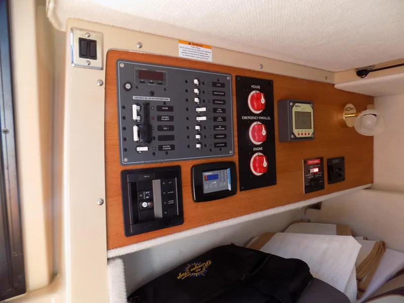 Slide: The Image of 2019 Ranger Tugs R-23 control panel with switches and gauges in cabin interior. - 12