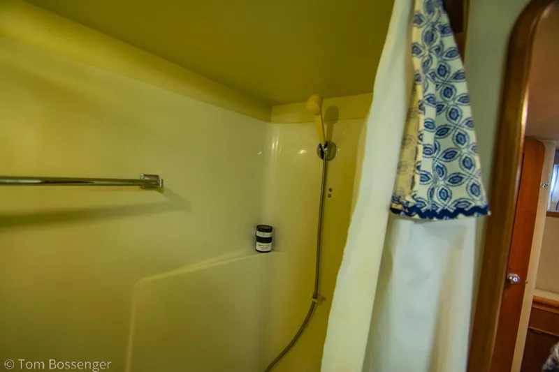 Slide: The Image of Shower area in 1986 Chris-Craft Corinthian boat with curtain and towel. - 28
