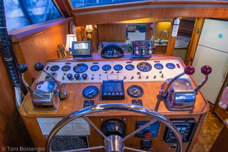 Slide: The Image of 1986 Chris-Craft Corinthian boat helm with vintage controls and gauges. - 33