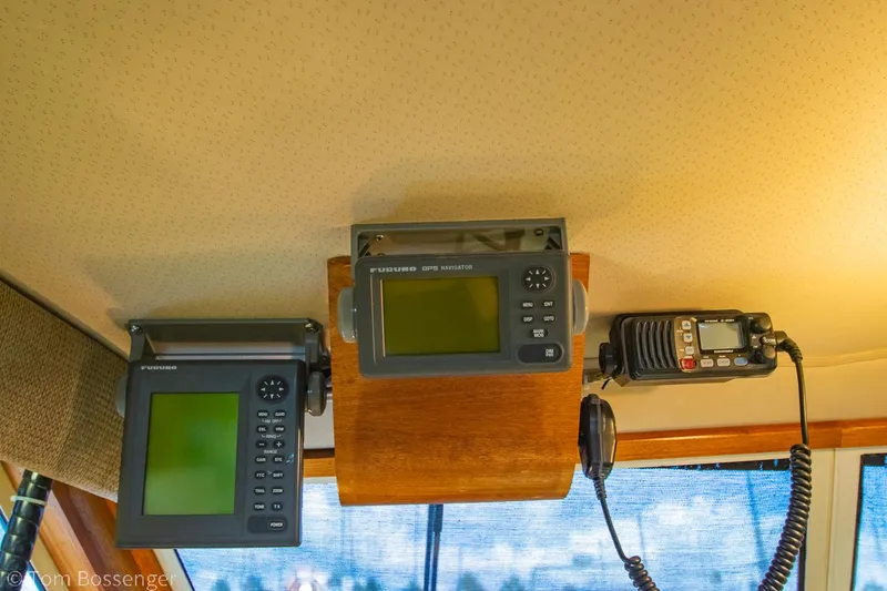 Slide: The Image of 1986 Chris-Craft Corinthian boat dashboard with navigation and communication equipment. - 37