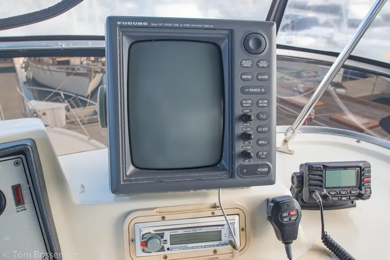 Slide: The Image of 1986 Chris-Craft Corinthian helm with Furuno radar and communication equipment. - 47