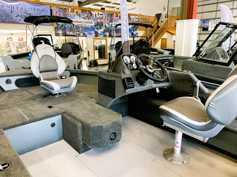 Slide: The Image of 2023 Starcraft Storm 166 SC Pro boat interior with seating and control console. - 10