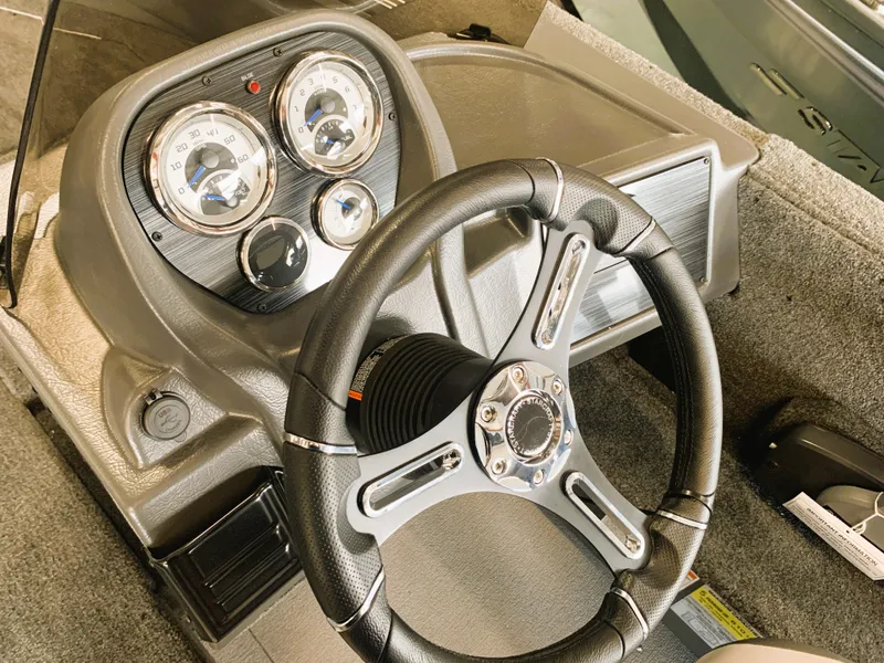 Slide: The Image of 2023 Starcraft Storm 166 SC Pro boat dashboard with steering wheel and instrument panel. - 11