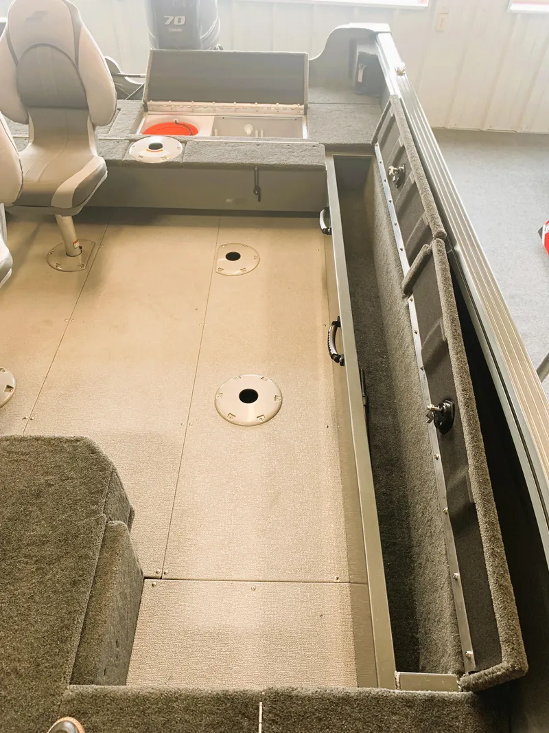 Slide: The Image of 2023 Starcraft Storm 166 SC Pro boat interior with seating and storage compartments. - 7