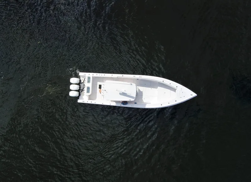 Slide: The Image of Aerial view of a 2016 Fountain 38 CC Tournament Edition boat on water. - 14
