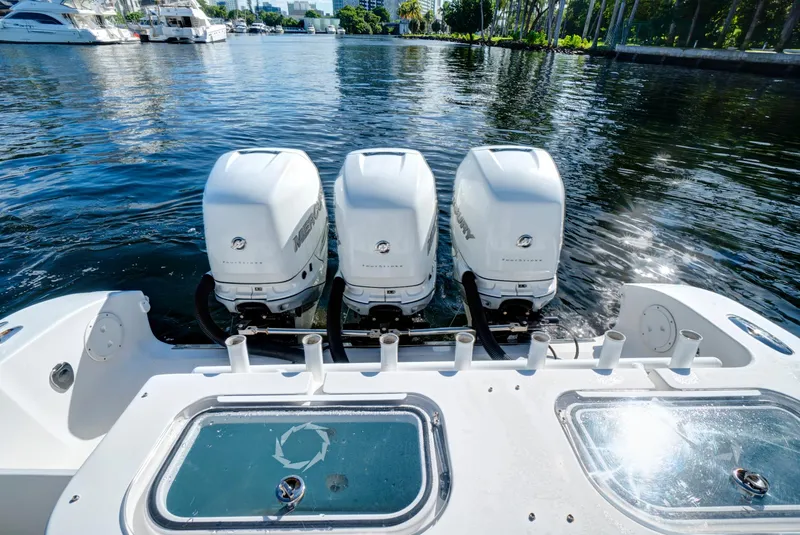 Slide: The Image of 2016 Fountain 38 CC Tournament Edition boat with triple outboard engines. - 15