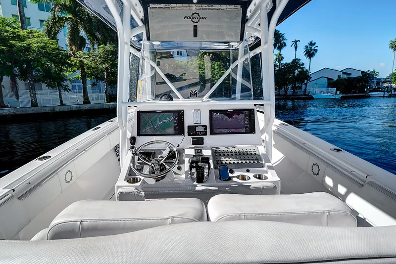 Slide: The Image of 2016 Fountain 38 CC Tournament Edition boat cockpit with navigation system. - 18