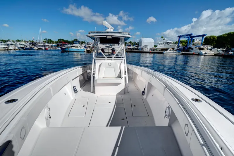 Slide: The Image of 2016 Fountain 38 CC Tournament Edition boat docked at a marina on a sunny day. - 25