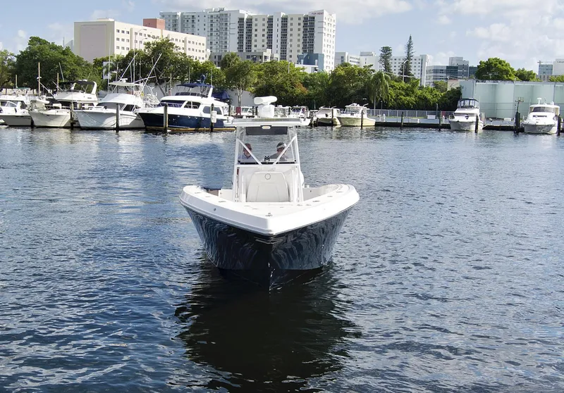 Slide: The Image of 2016 Fountain 38 CC Tournament Edition boat docked in a marina. - 5