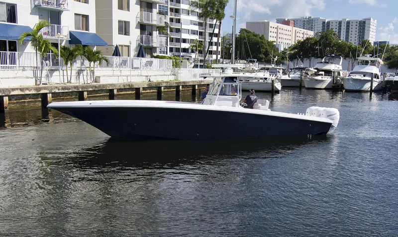 Slide: The Image of 2016 Fountain 38 CC Tournament Edition boat docked in a marina. - 8