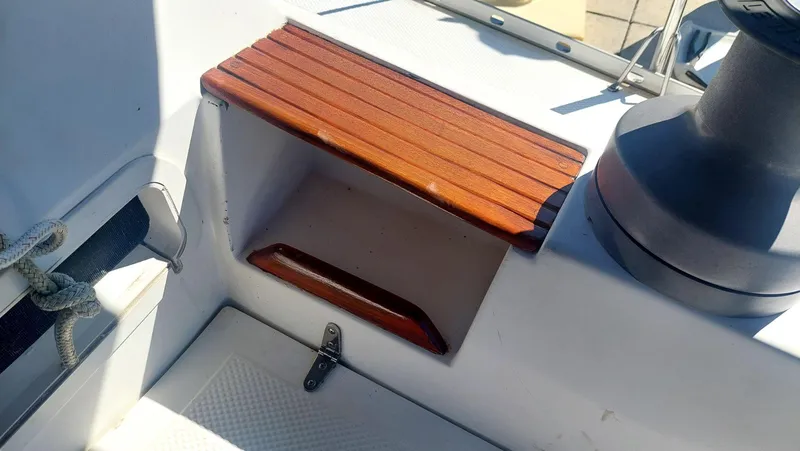 Slide: The Image of 1987 Hunter 34 sailboat cockpit detail with wooden step and winch. - 43